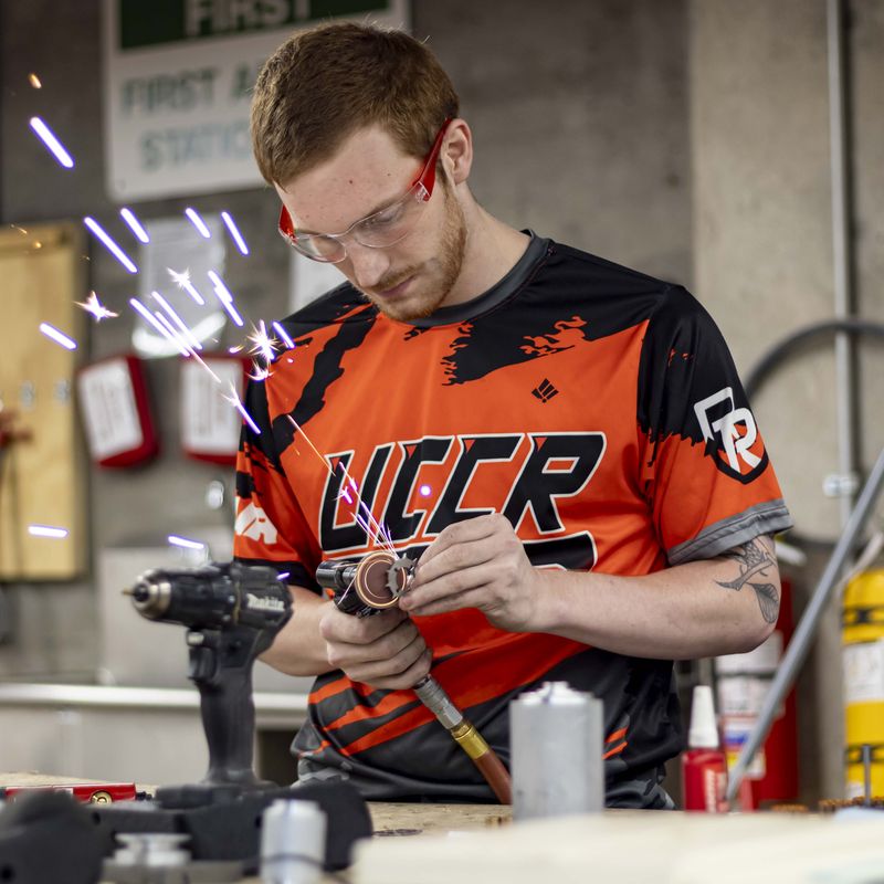 A member fabricating robot parts in the shop